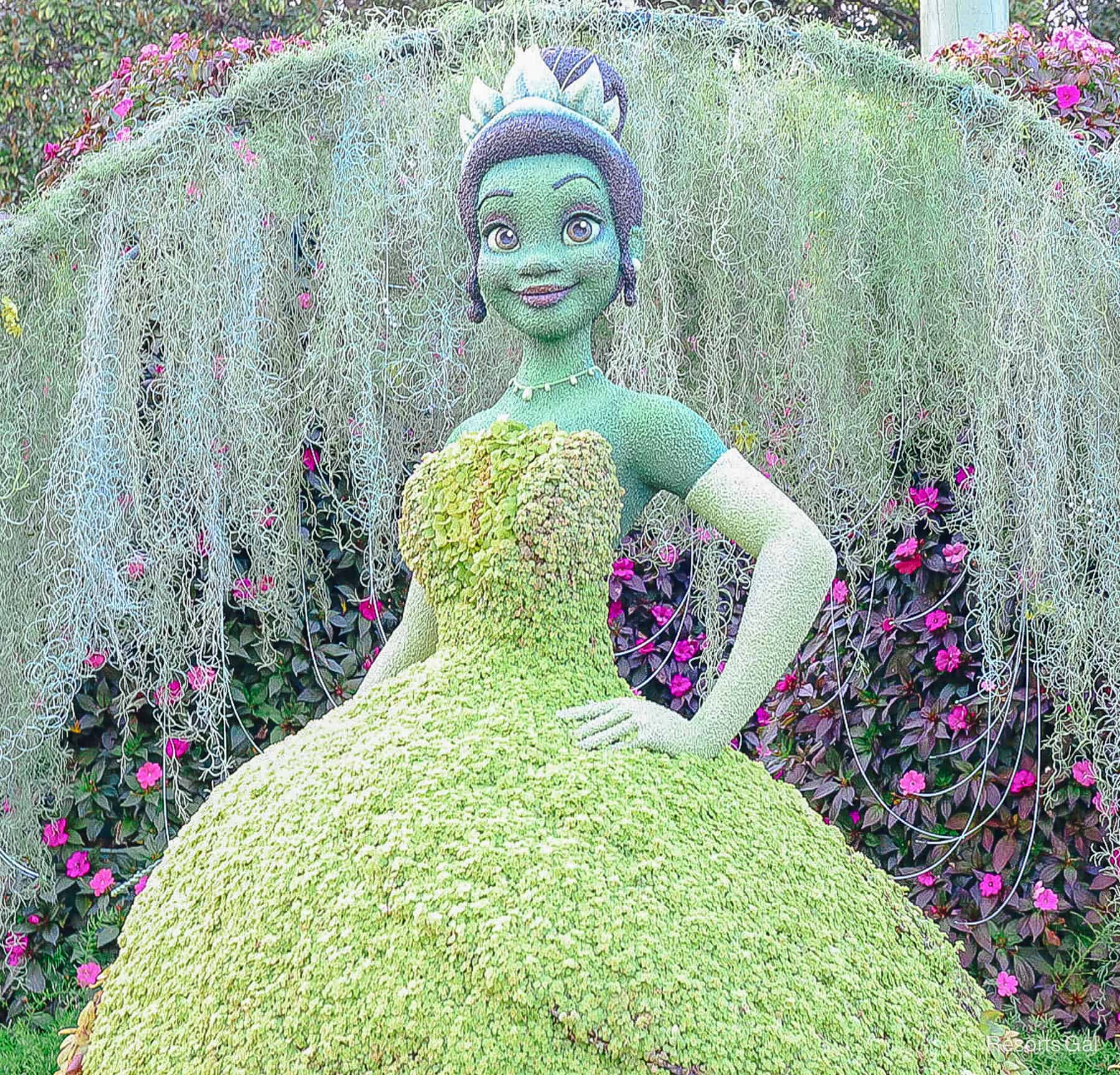 Princess Tiana in topiary form with hand on hip. 