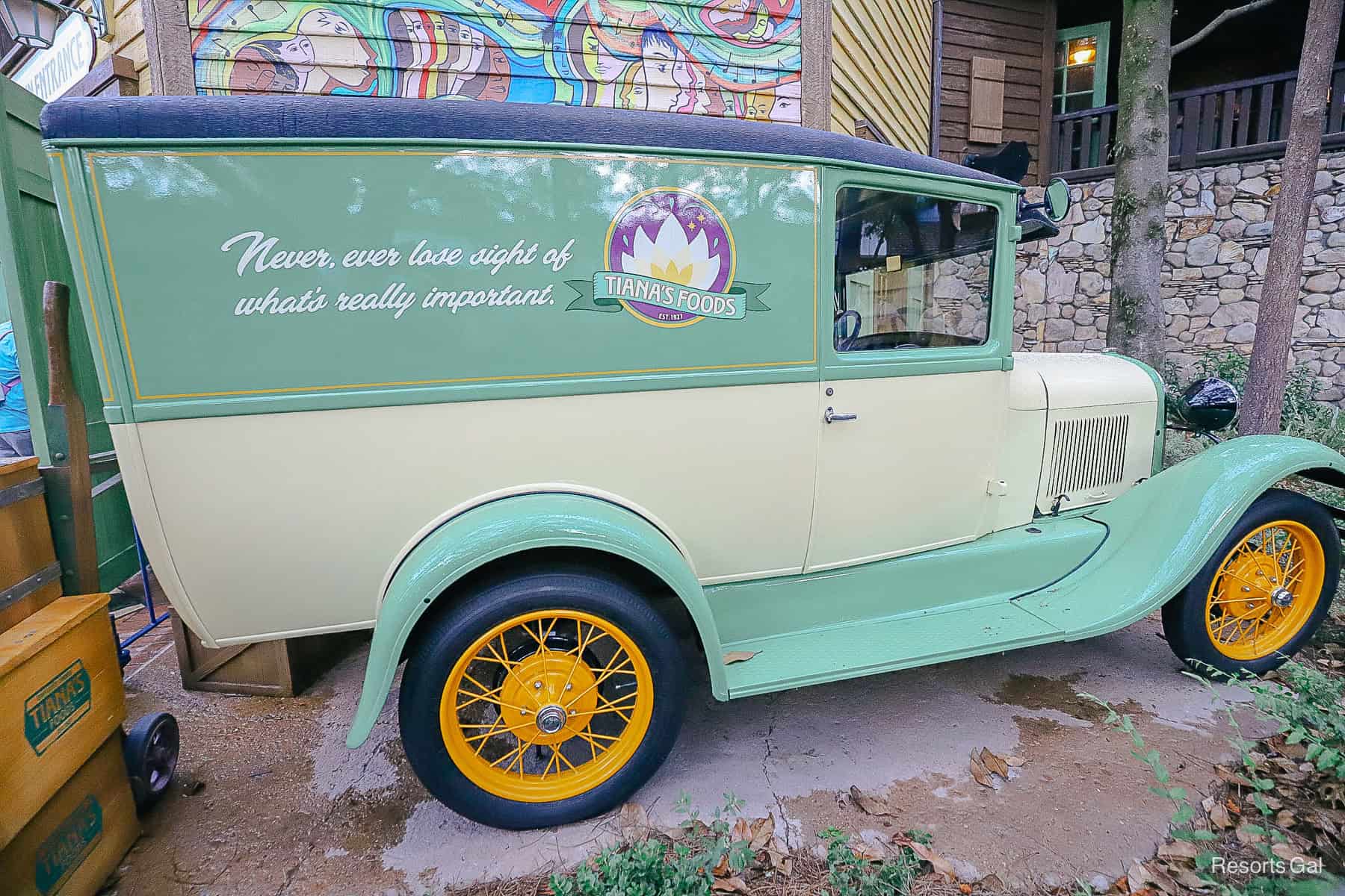 an antique vehicle in the queue of Tiana's Bayou Adventure that says Tiana's Foods and "Never, ever lose sight of what's really important." 
