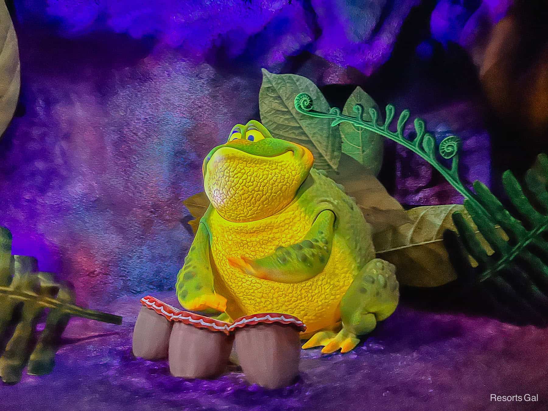 a frog playing drums 