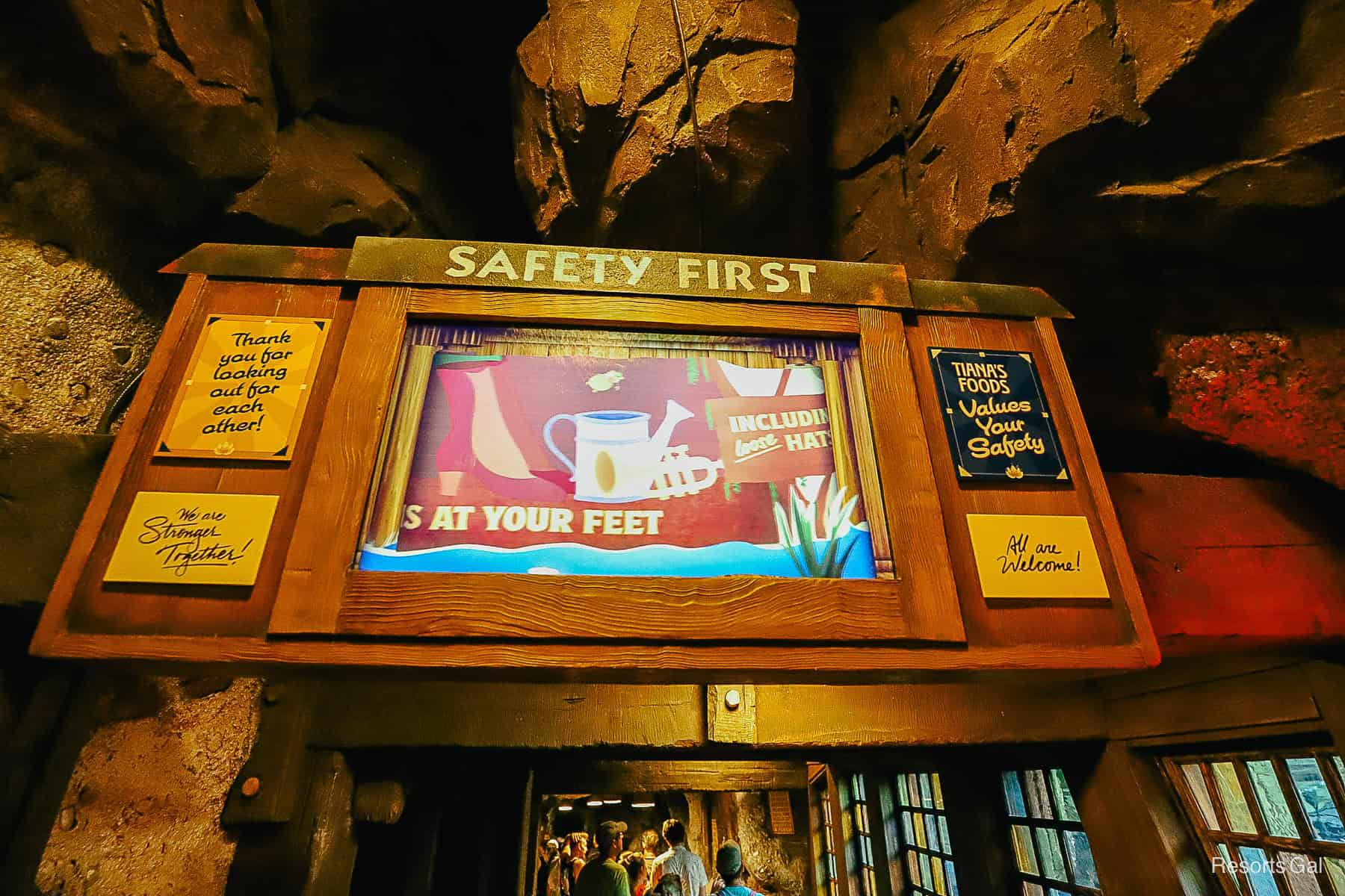 a tv screen that instructs guests about safety on the ride 