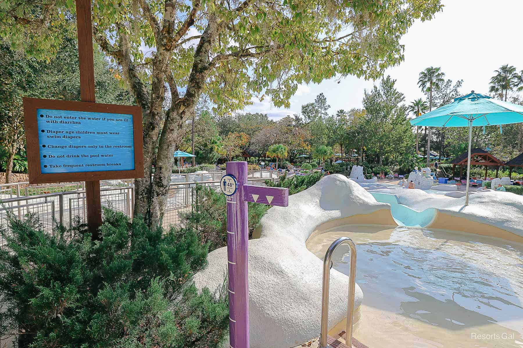 a small pool where children enter the slide 