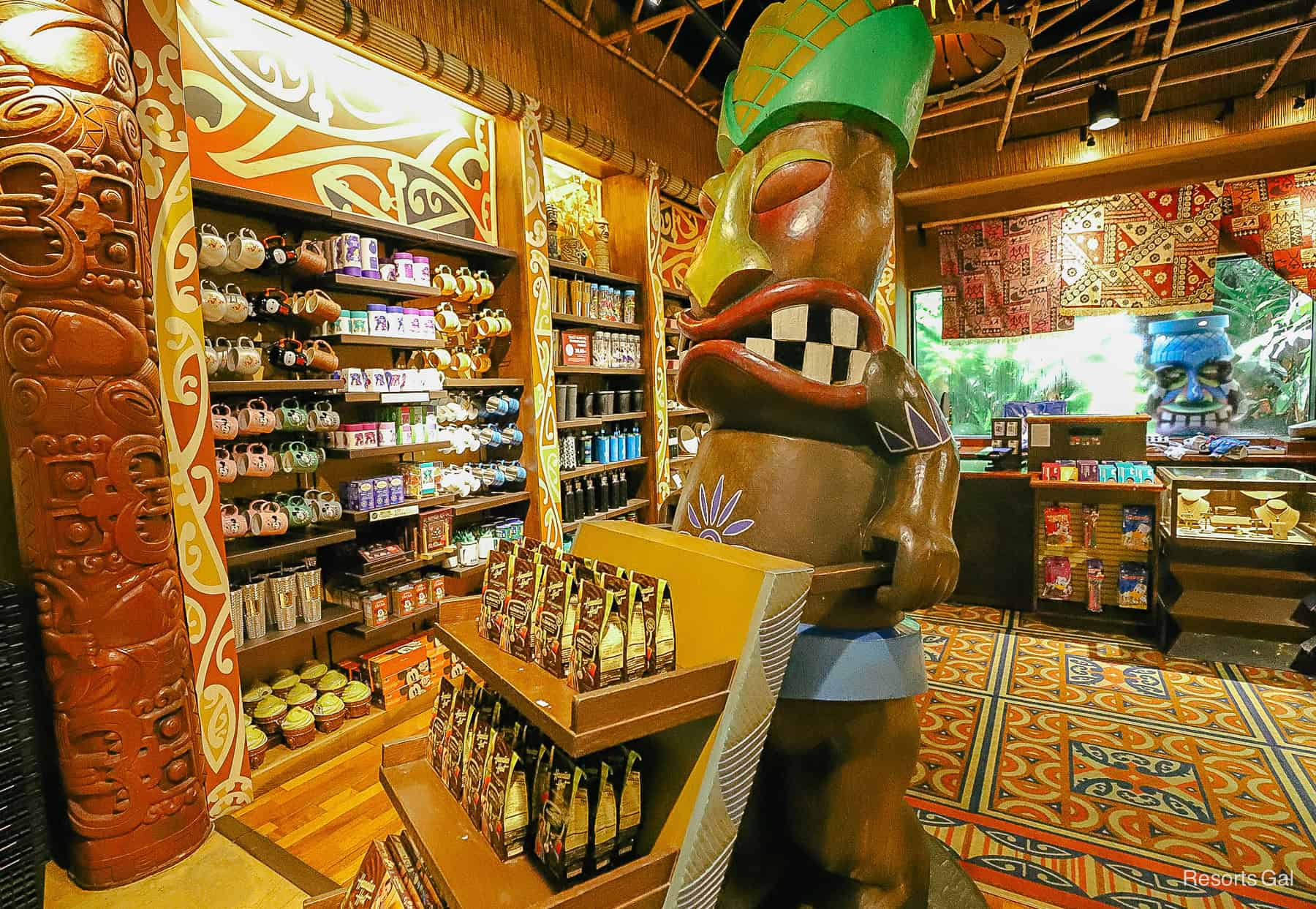 a Tiki statue who serves as part of a display shelf 