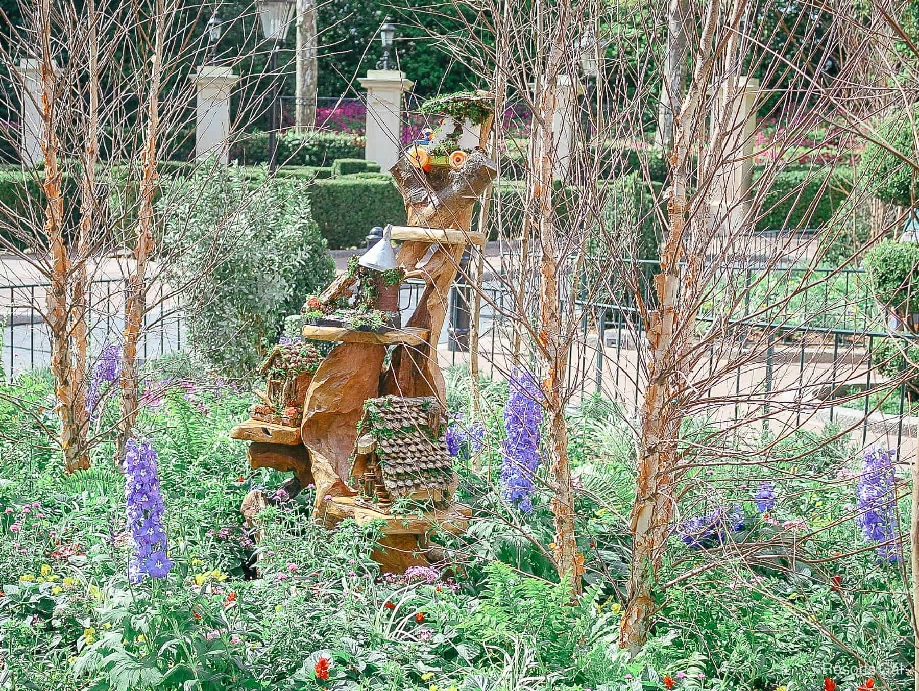 a grouping of Fairy Garden houses in Tinker Bell's garden 