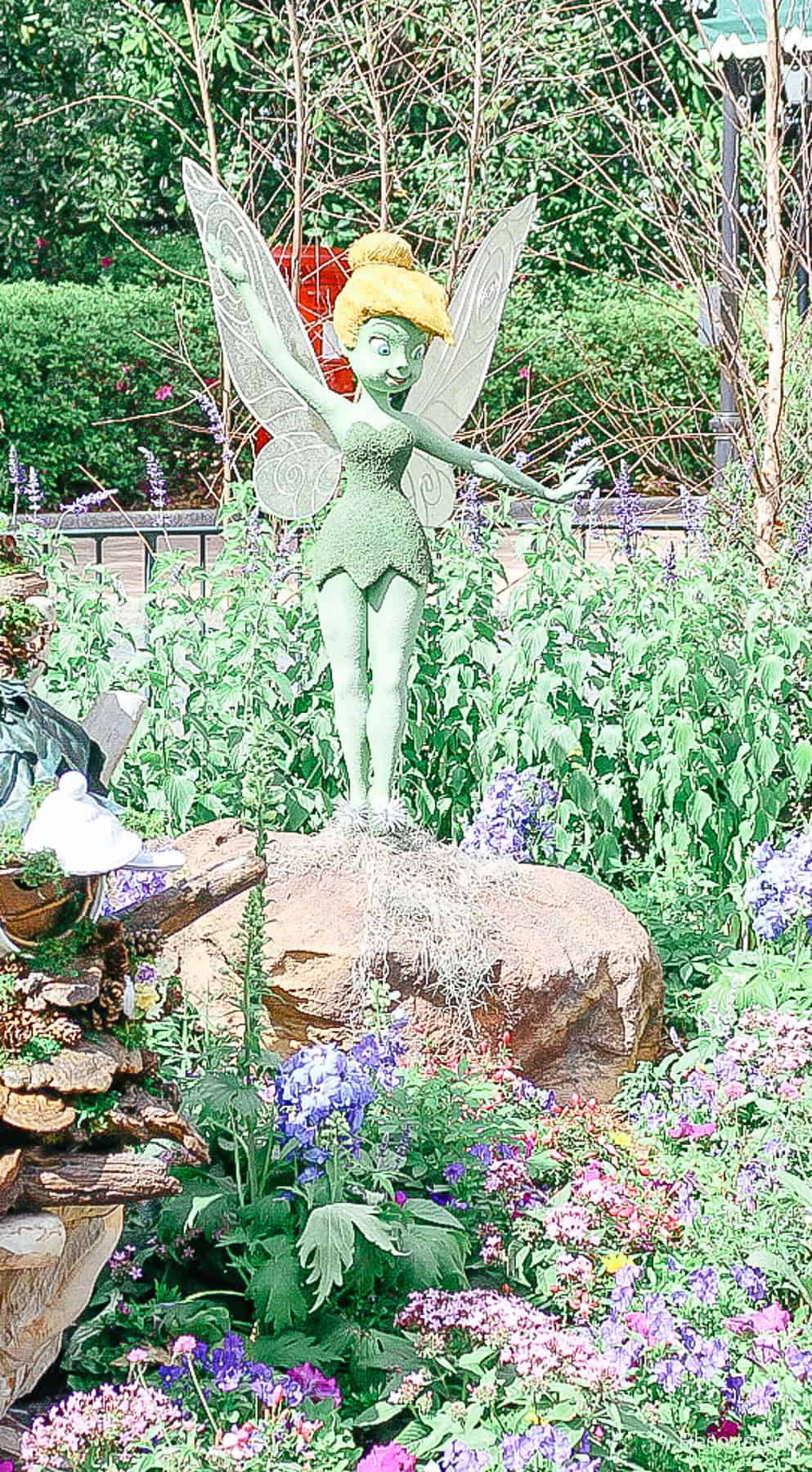 cropped image that shows Tinker Bell's blonde hair and pixie shoes 