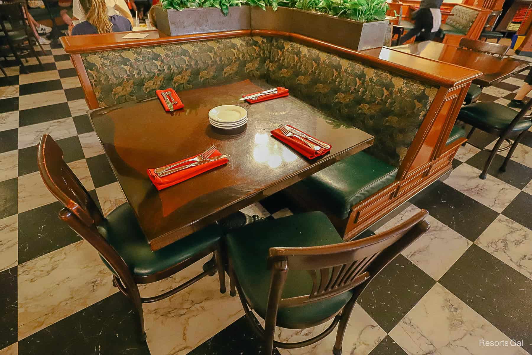 a table with chairs and the restaurant's ambiance 