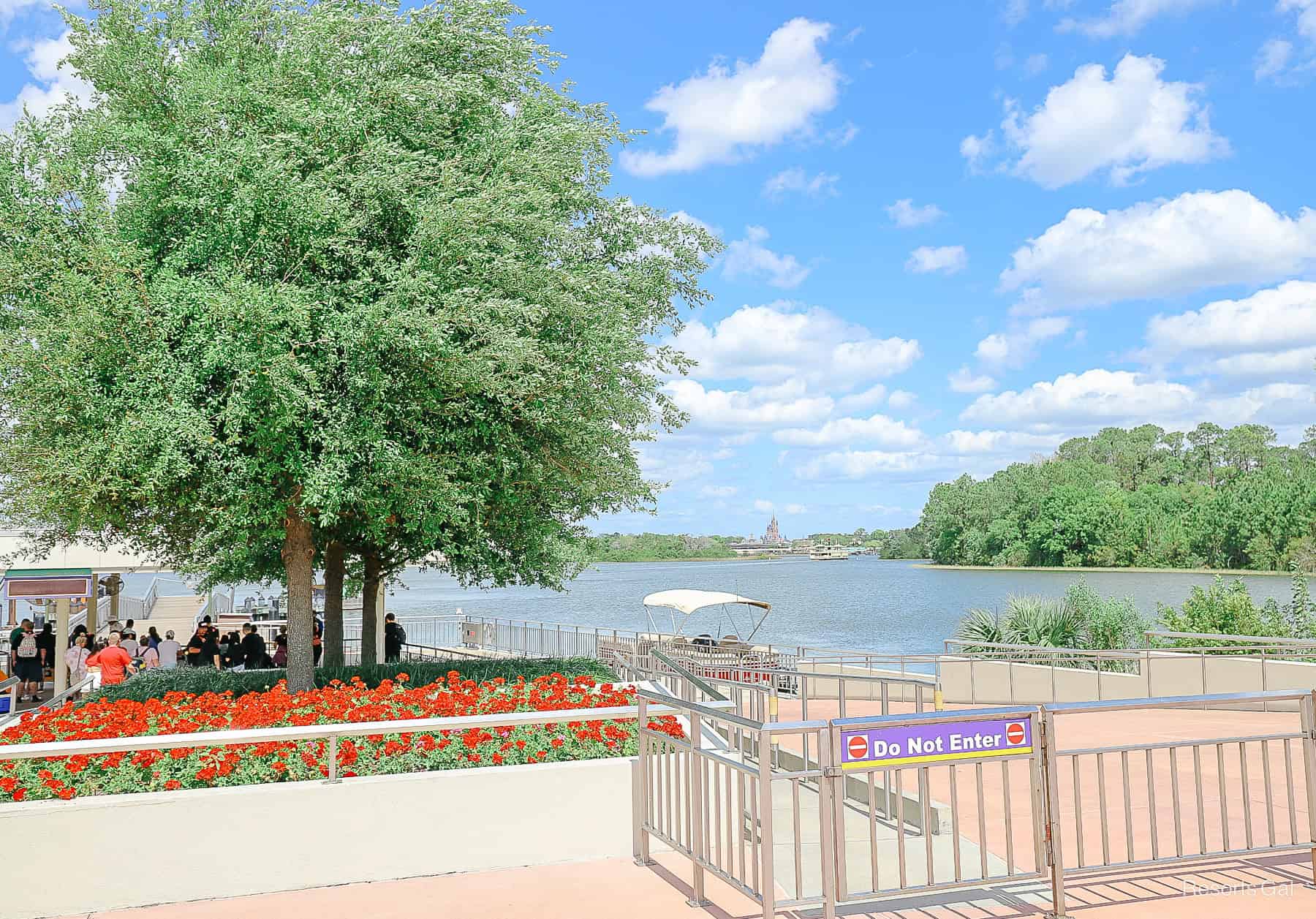 a view of Cinderella Castle as it sits across the lake from the Transportation and Ticket Center 