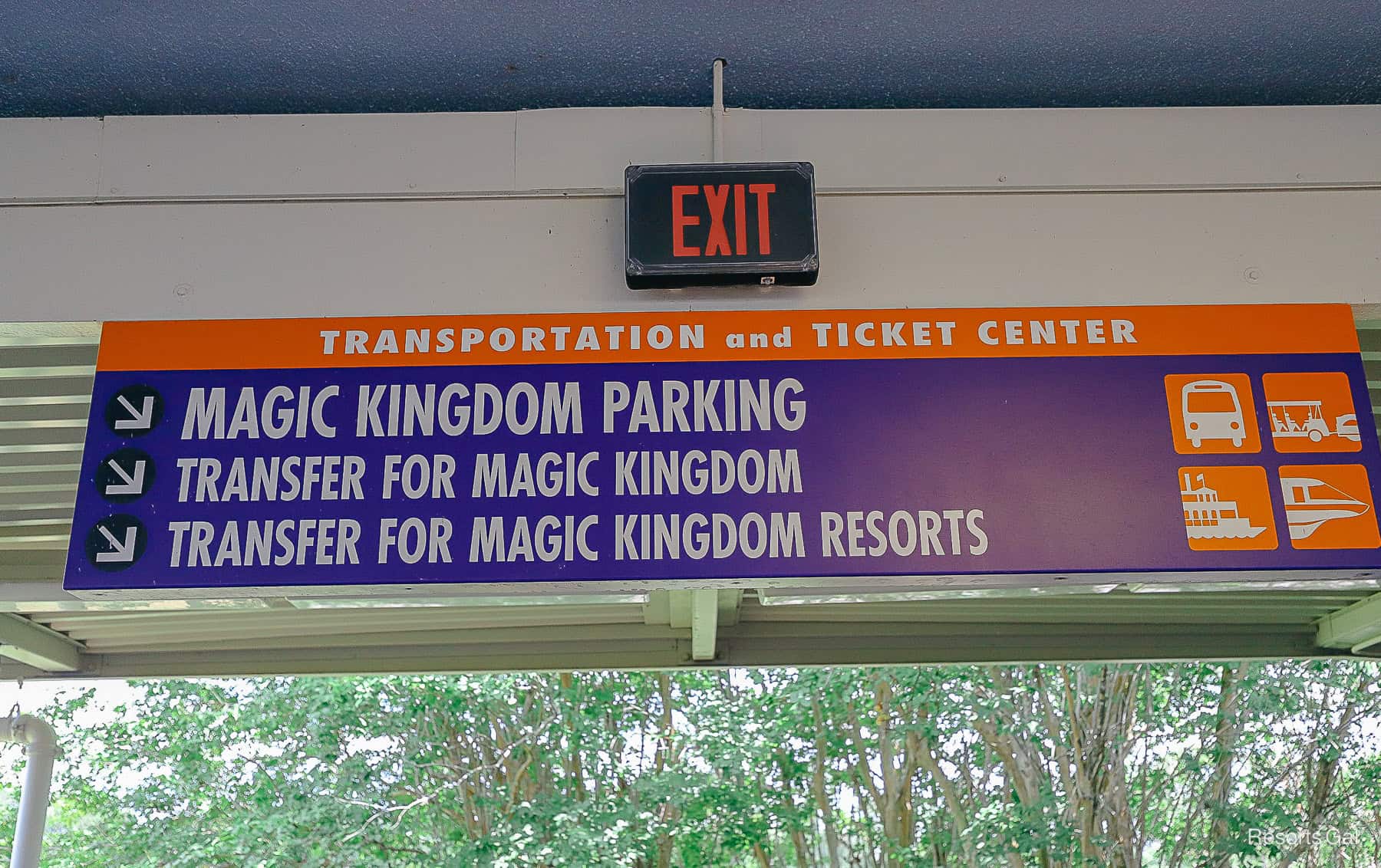 a sign at the Transportation and Ticket center that directs guests to the Magic Kingdom transfer from Epcot 