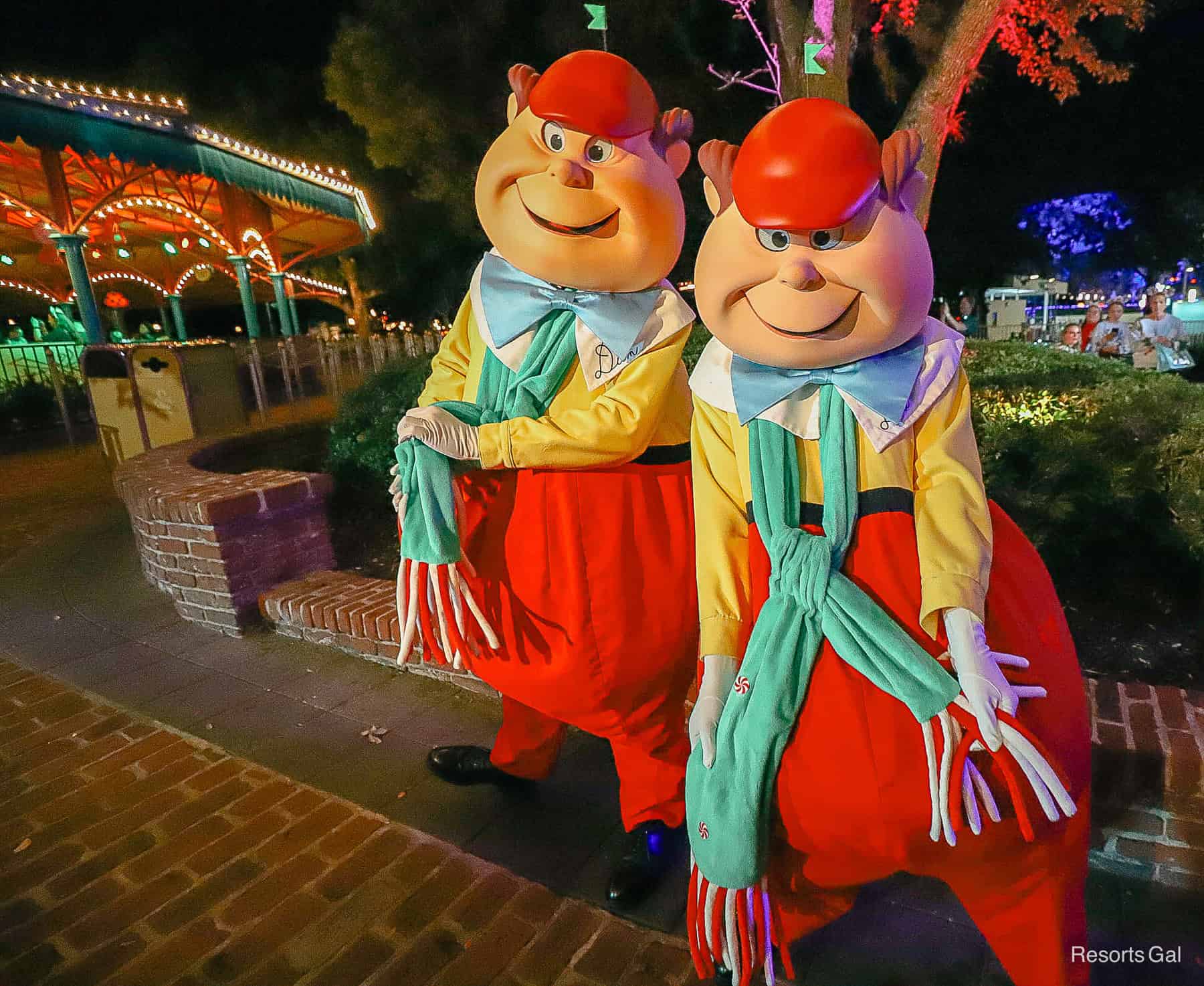 The Tweedles pose for a photo in green holiday scarves. 