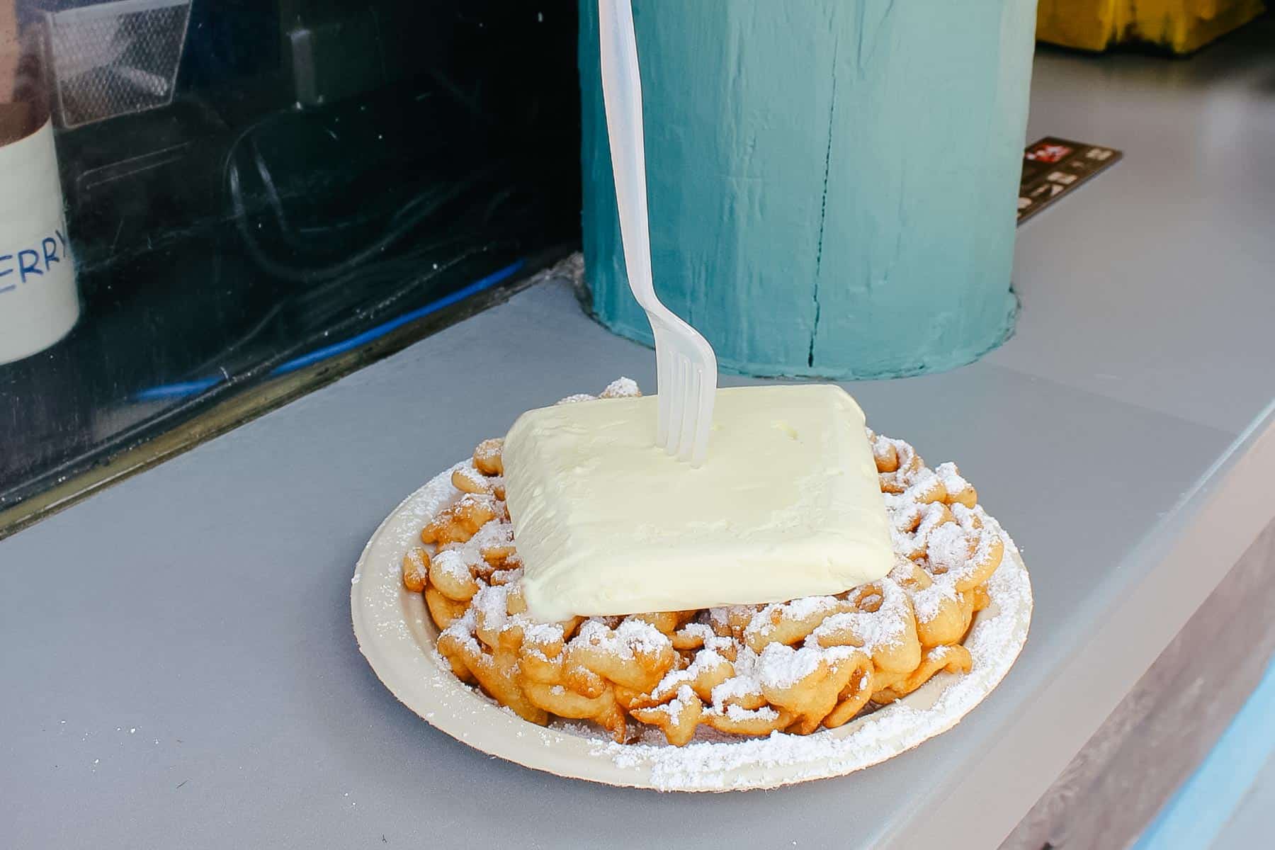 a funnel cake topped with ice cream 