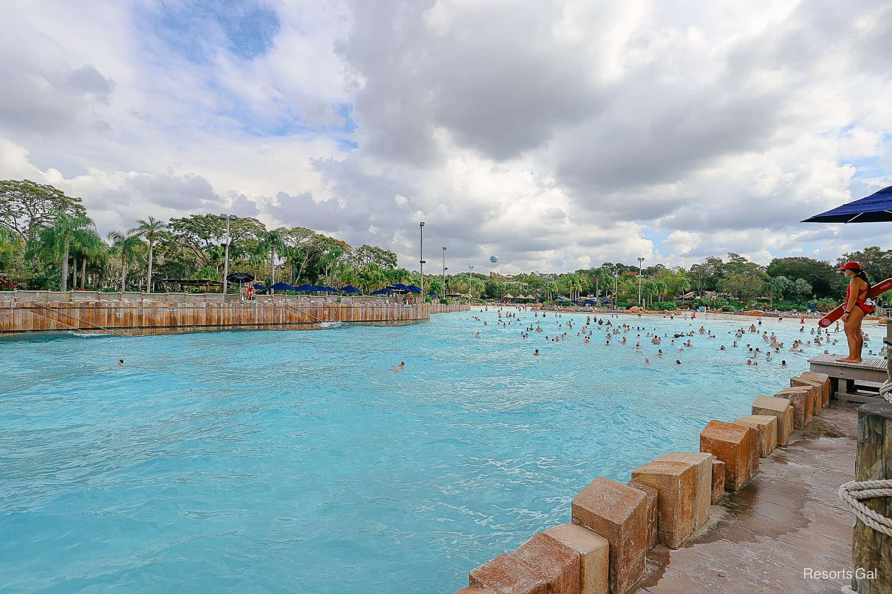 a lifeguard watching guests in the wave pool 