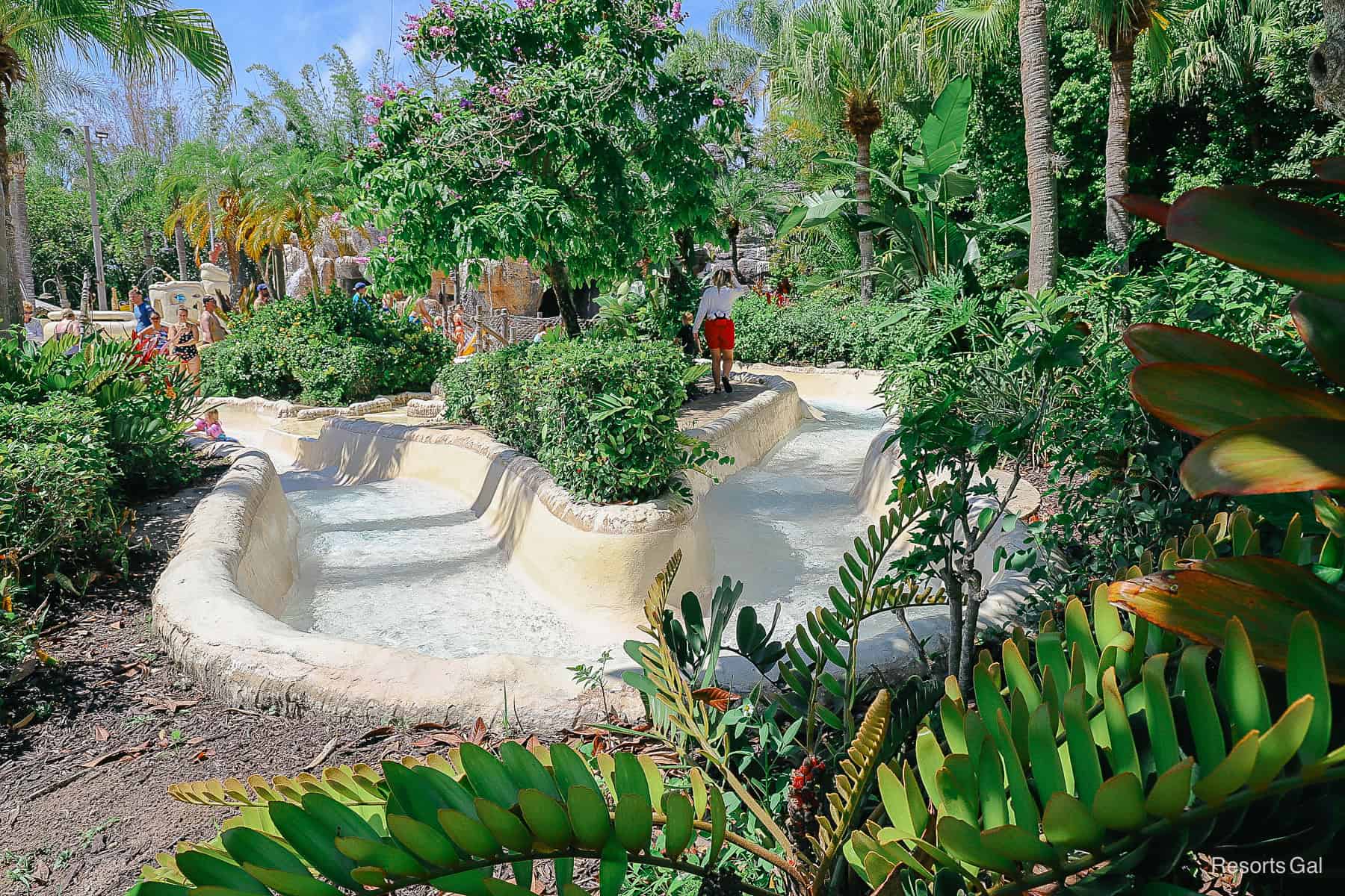 the path of the raft ride with landscaping surrounding it 