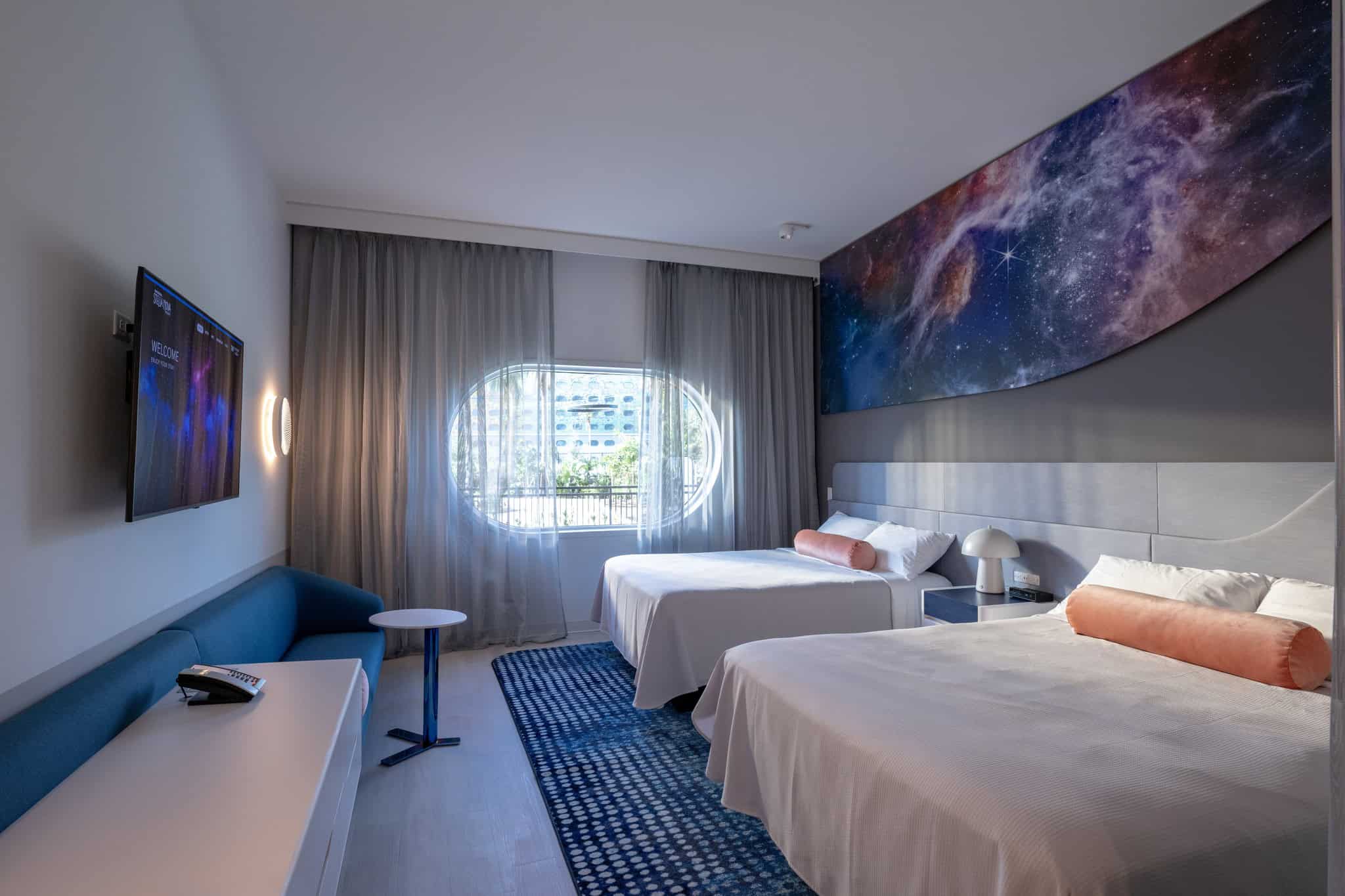 a standard room with two beds at Universal Stella Resort 