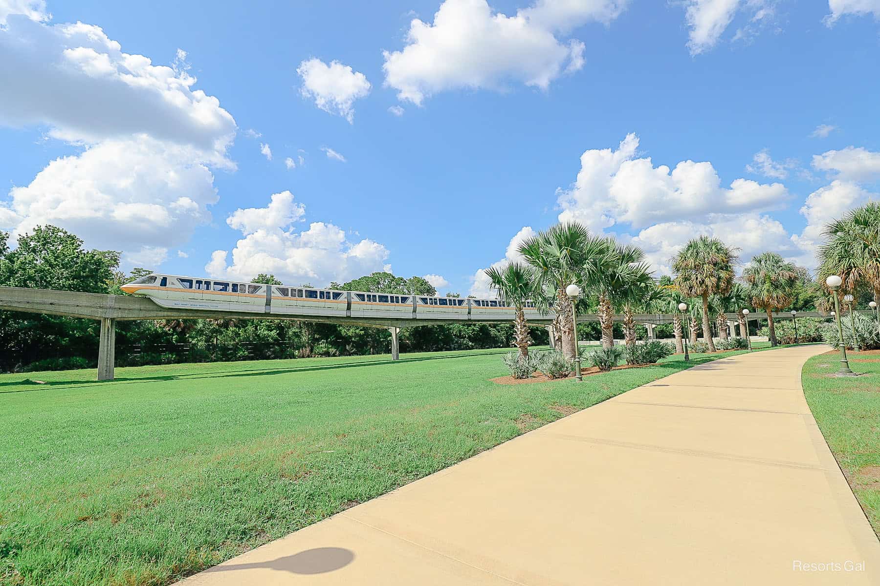 the monorail passes the Grand Floridian walking path 