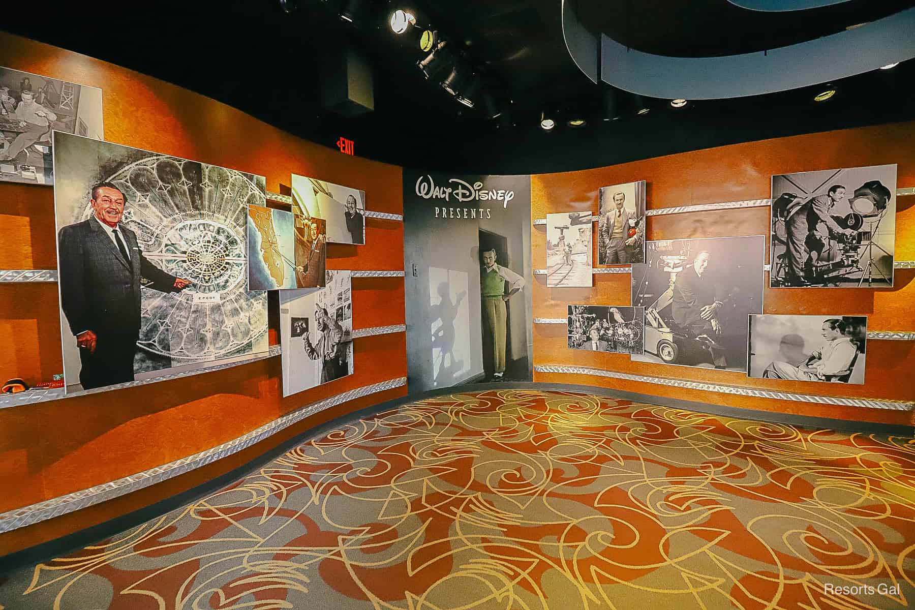 the foyer to Walt Disney Presents at Disney's Hollywood Studios featuring black-and-white photos of Walt Disney 