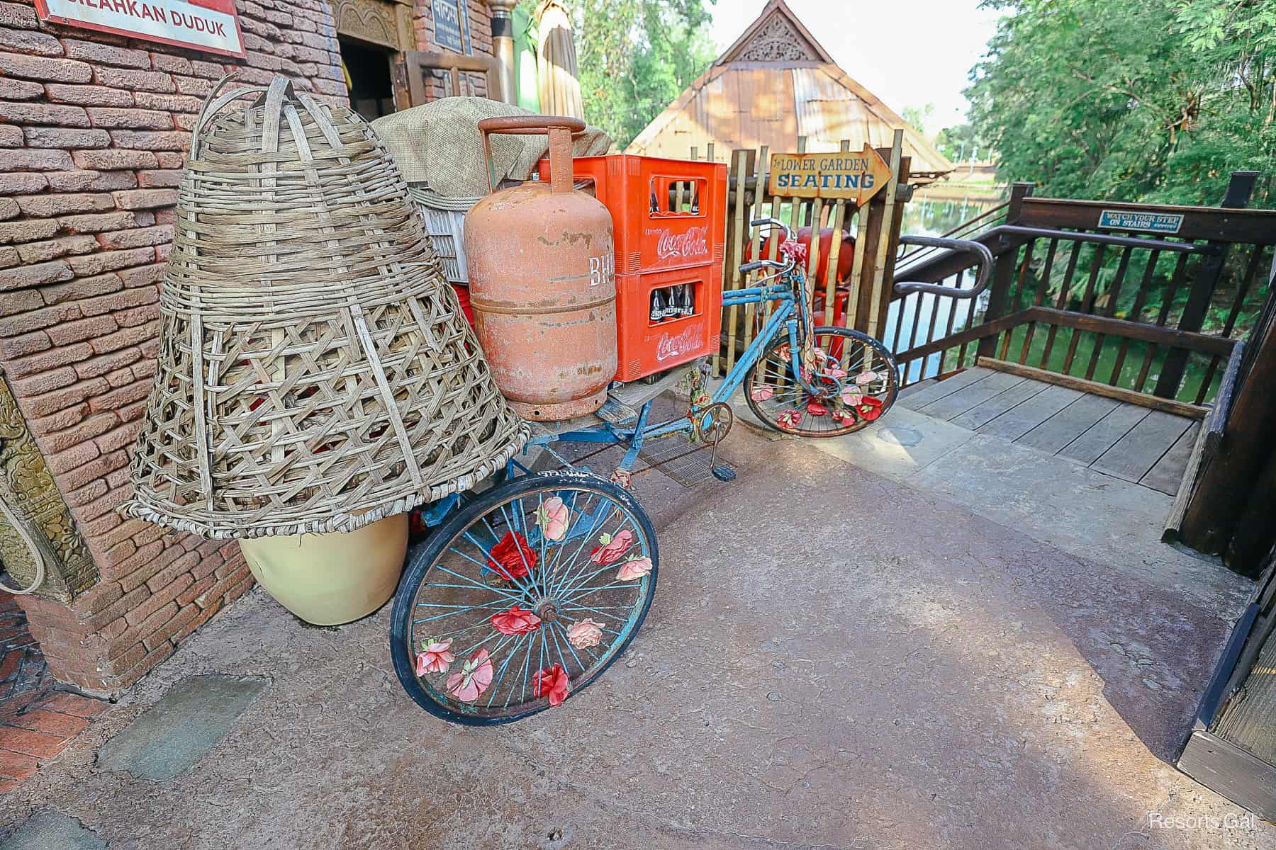 decorative bicycle and baskets to imply Asian theming near Yak and Yeti Quick Service 