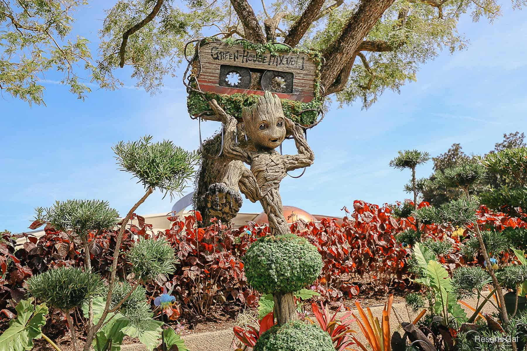 Young Groot Topiary holds up a Green-House Mix Vol. 1 Cassette Tape 